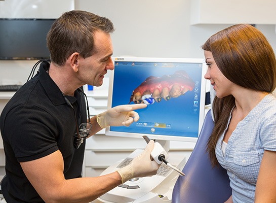 Dentist showing woman her digital impressions