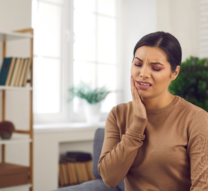 Closeup of woman experiencing toothache at home