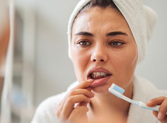 A woman brushing her teeth