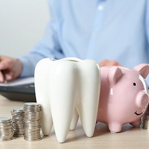 Piggy bank next to coins