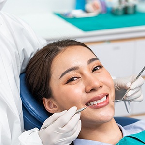 Woman smiling in the dental chair