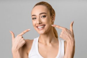 Woman smiling after cosmetic dental work