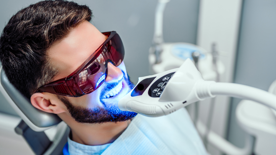 Man getting professional whitening treatment